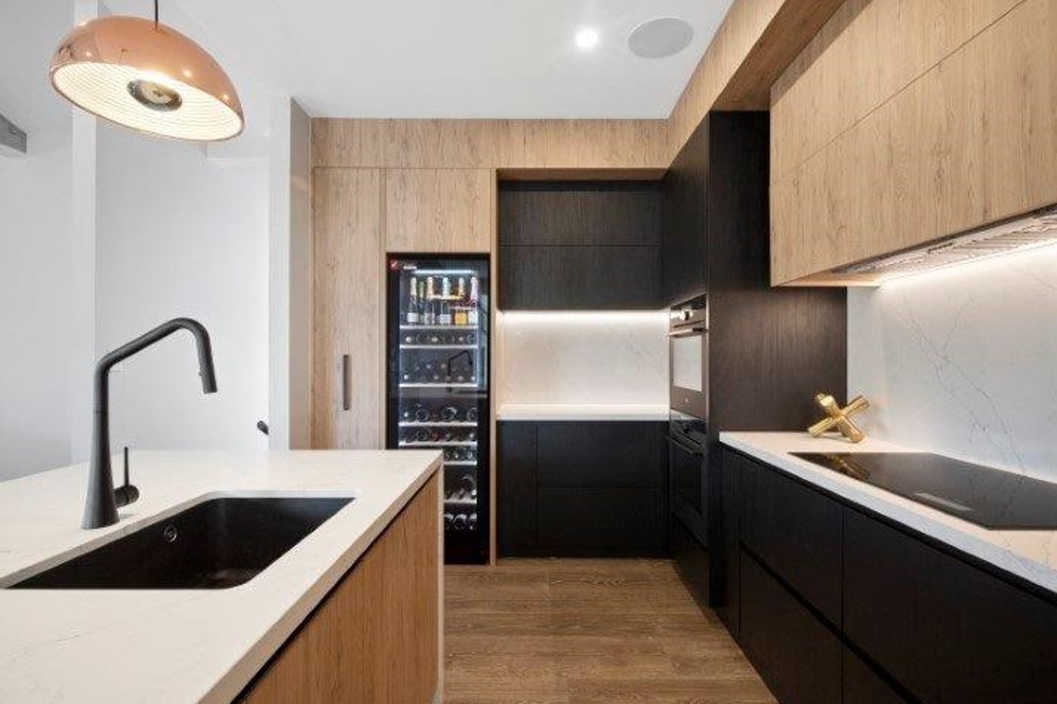 Modern kitchen with wood grain paneling